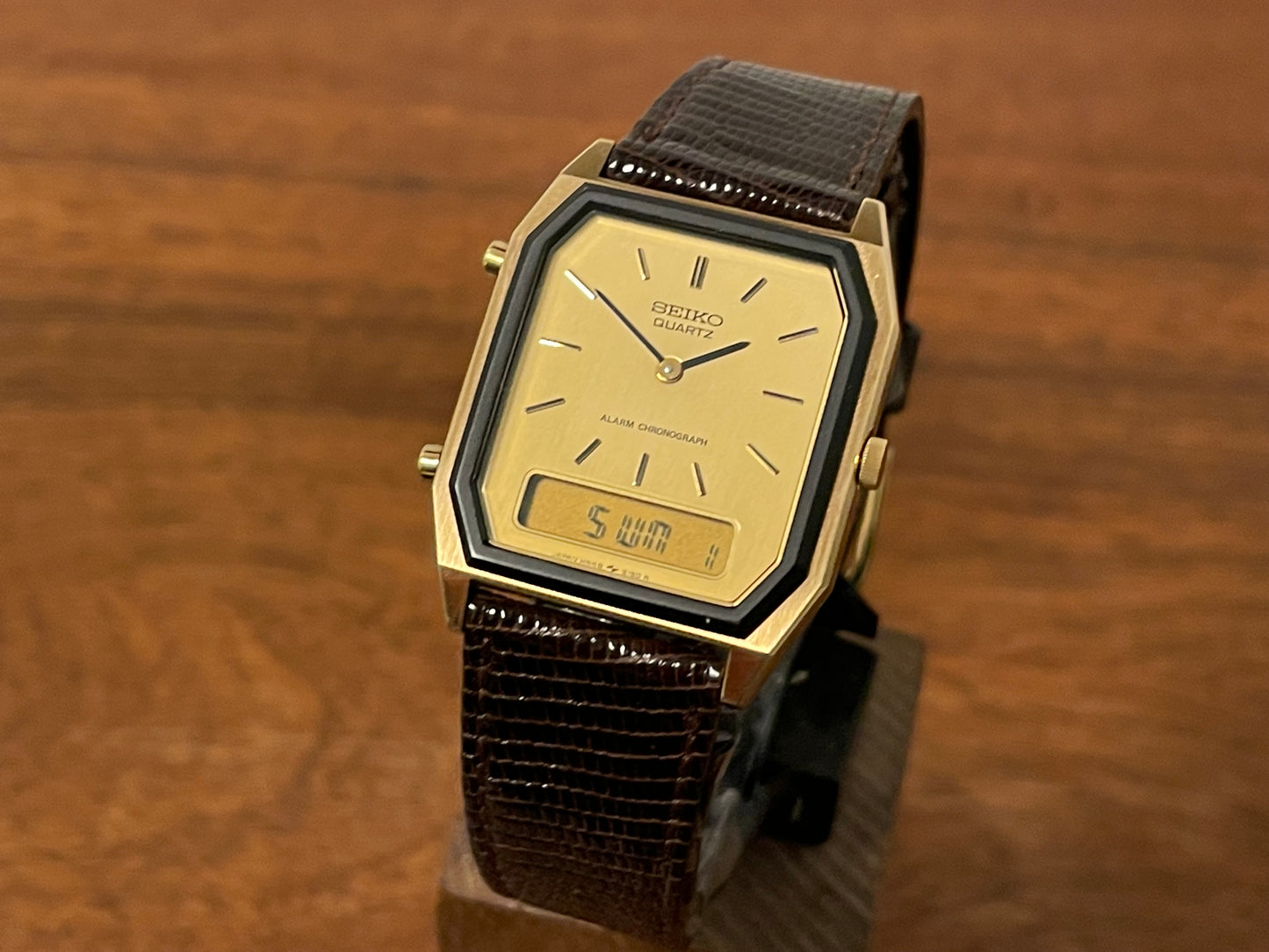 Front side (1984) Seiko H448-5130 Alarm Chronograph - gold dial w/ gold markers & digital display