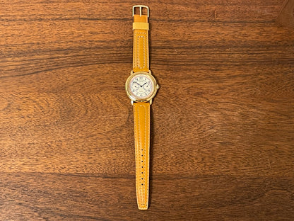 (1988) Pulsar V336-7040 dress watch - gold colored case - creme dial w/ Arabic numerals