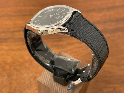 (1982) Pulsar Y112-5099 "Ellipse" dress watch - silver case - black dial w/ silver stick markers (NOS)