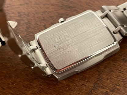 (1990) Citizen 1015-H23389 - integrated bracelet - black dial w/ silver Arabic numerals & markers (NOS)