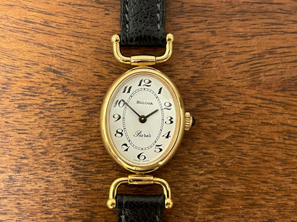 (1980s/1990s) Bulova Paris dress watch - oval case - cream dial w/ black Arabic numerals - small size (NOS)
