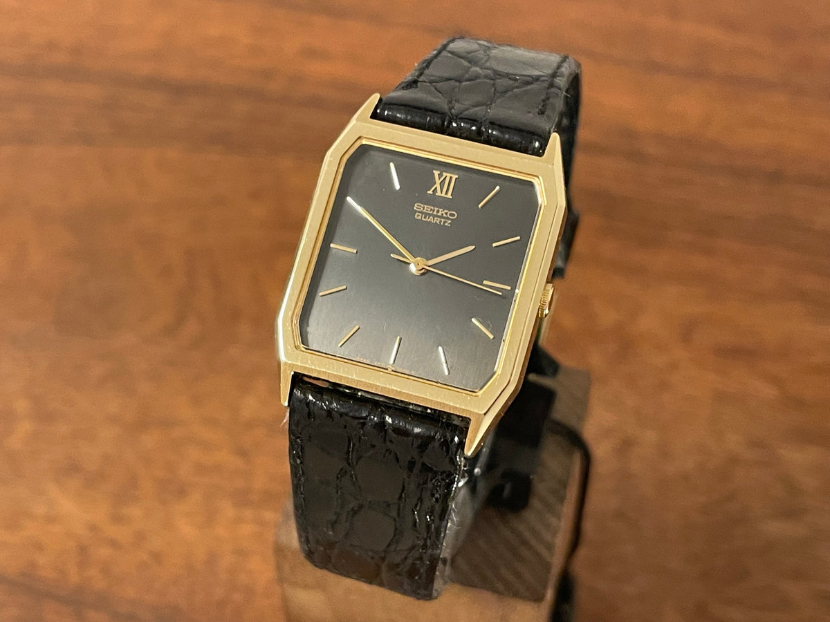 Front side (1986) Seiko 5P31-5030 Quartz "Tank" dress watch - brushed dark grey dial w/ gold markers (NOS)