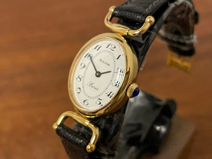 (1980s/1990s) Bulova Paris dress watch - oval case - cream dial w/ black Arabic numerals - small size (NOS)