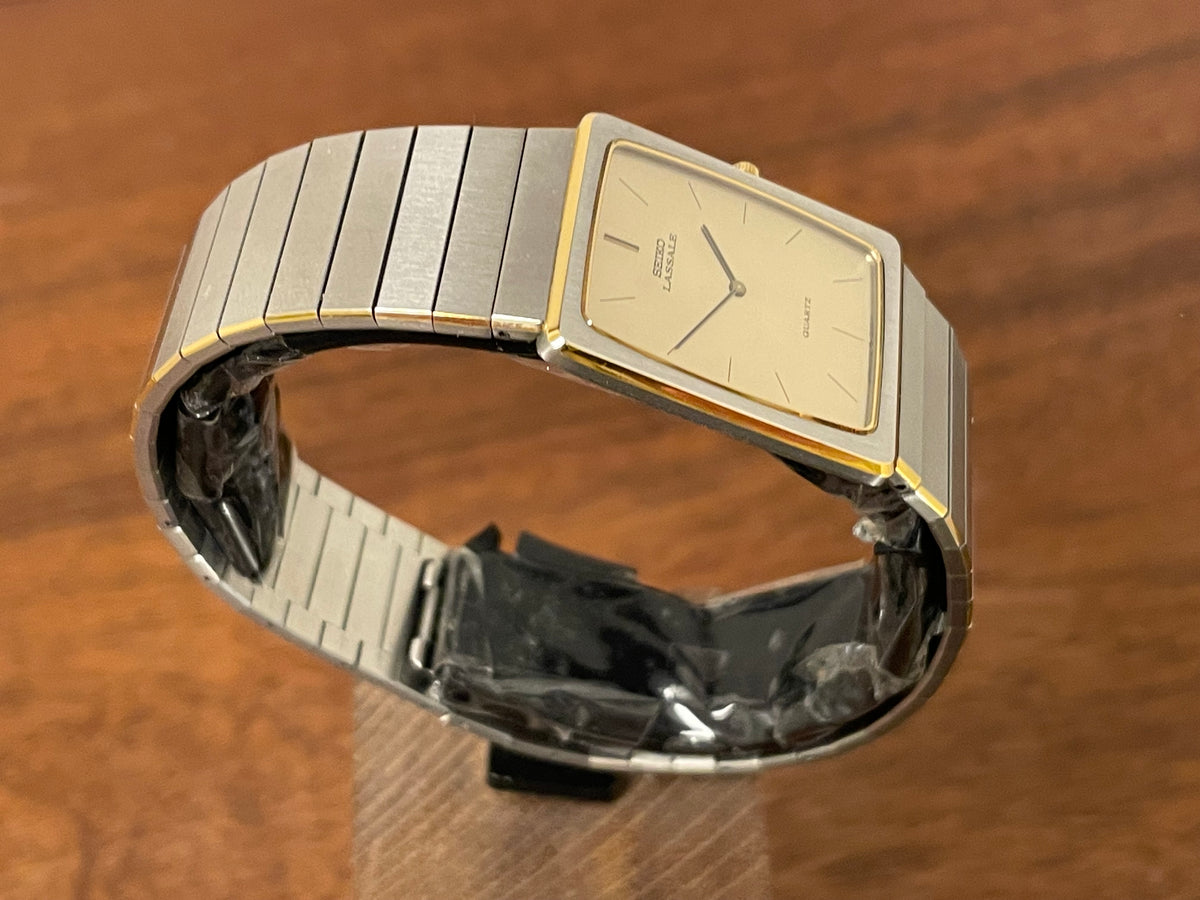 (1983) Seiko 6730-565H Lassale ultra thin - stainless steel bracelet - brushed gold dial w/ black stick markers (NOS)