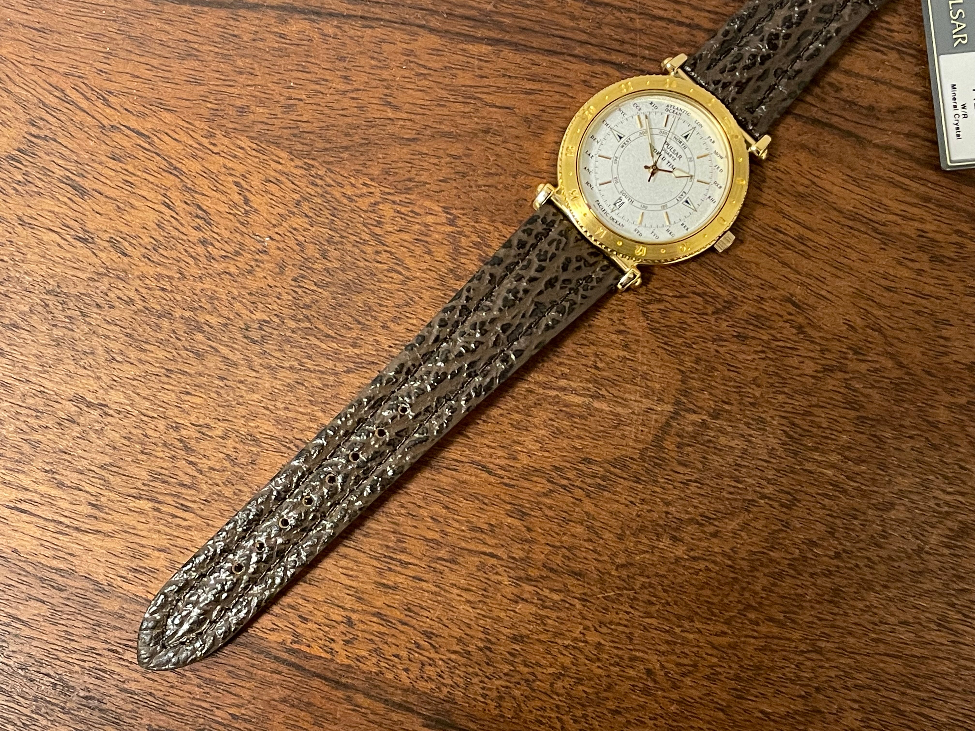 1992) Pulsar V722-7000 World Time - gold case - diamond dust dial