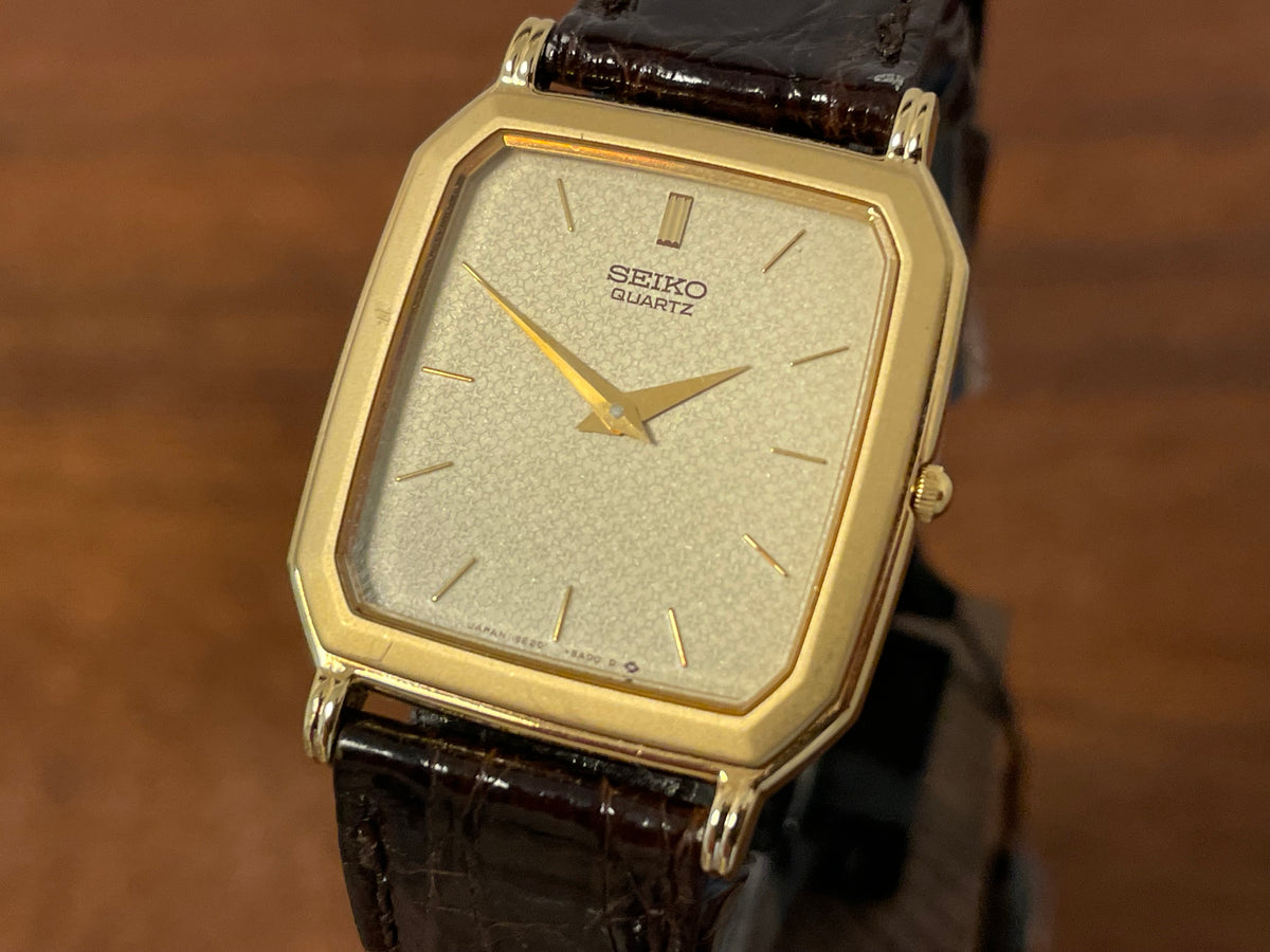 (1987) Seiko 5E20-5A00 "Tank" dress watch - champagne patterned dial w/ gold markers (NOS)