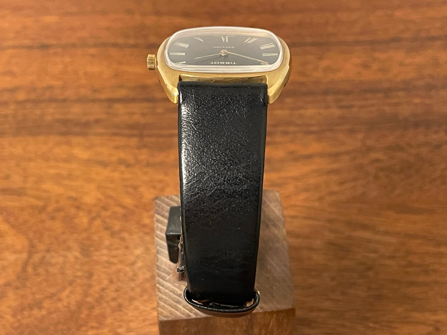 (1970s) Tissot Stylist dress watch - gold case - black dial w/ gold Roman numerals (NOS)