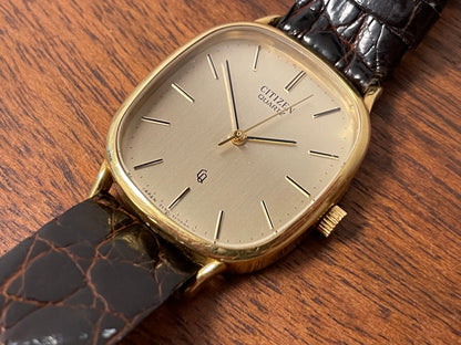 (1970s) Citizen 47-5181 "Ellipse" dress watch - 18K solid gold case - brushed champagne dial w/ gold markers