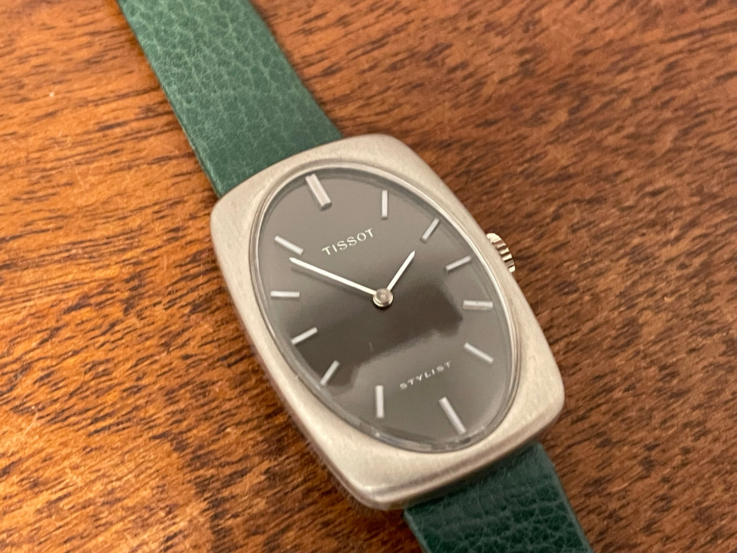(1970s) Tissot Stylist dress watch - oval grey sunburst dial w/ white stick markers - small size (NOS)