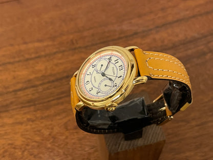 (1988) Pulsar V336-7040 dress watch - gold colored case - creme dial w/ Arabic numerals