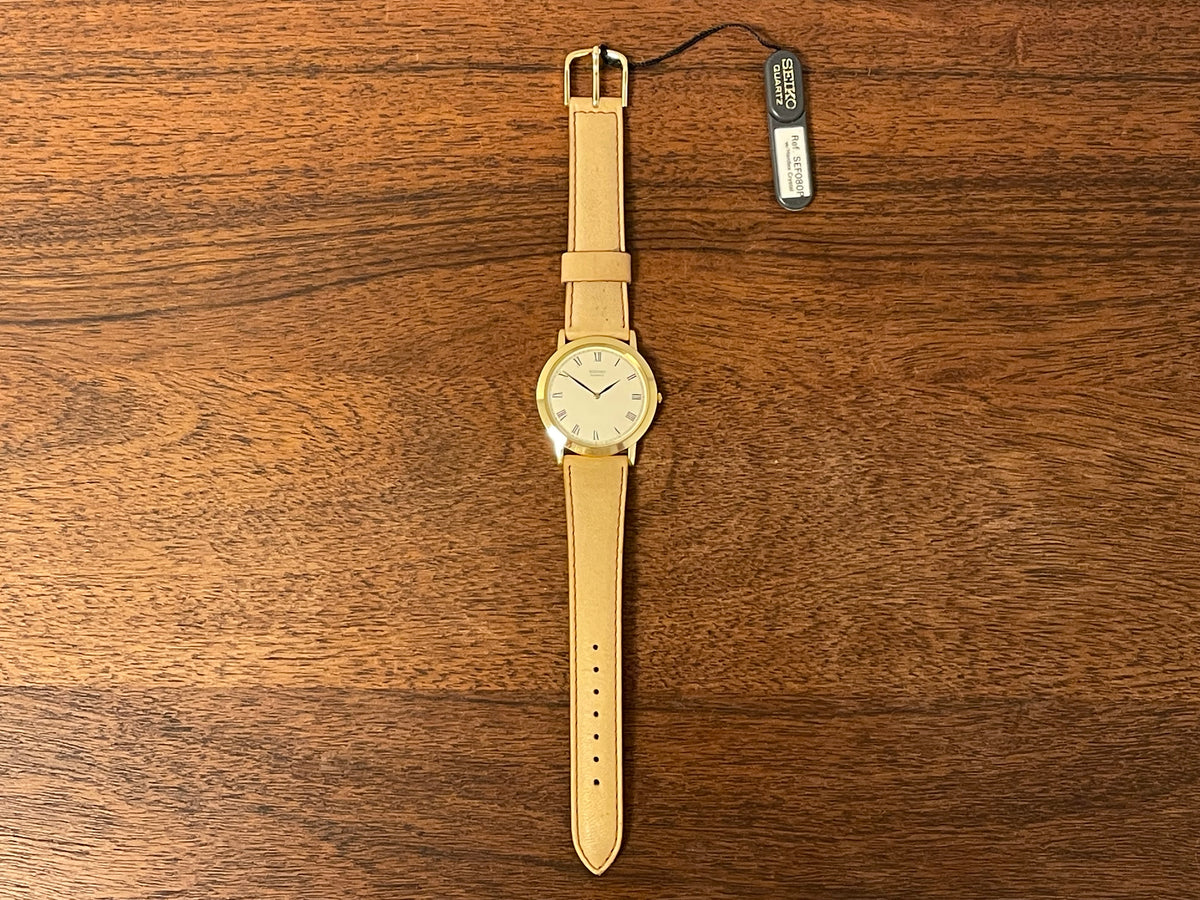 (1989) Seiko 5Y94-8000 dress watch - gold case - cream dial w/ black Roman numerals (NOS)