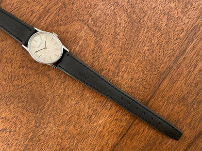(1970s) Tissot 052-10991 Stylist dress watch - silver oval case - silverdust dial w/ silver stick markers - small size (NOS)