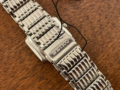 (1998) Seiko 1N00-0PT0 - rectangular case - silver dial w/ silver Roman numerals & markers - small size (NOS)