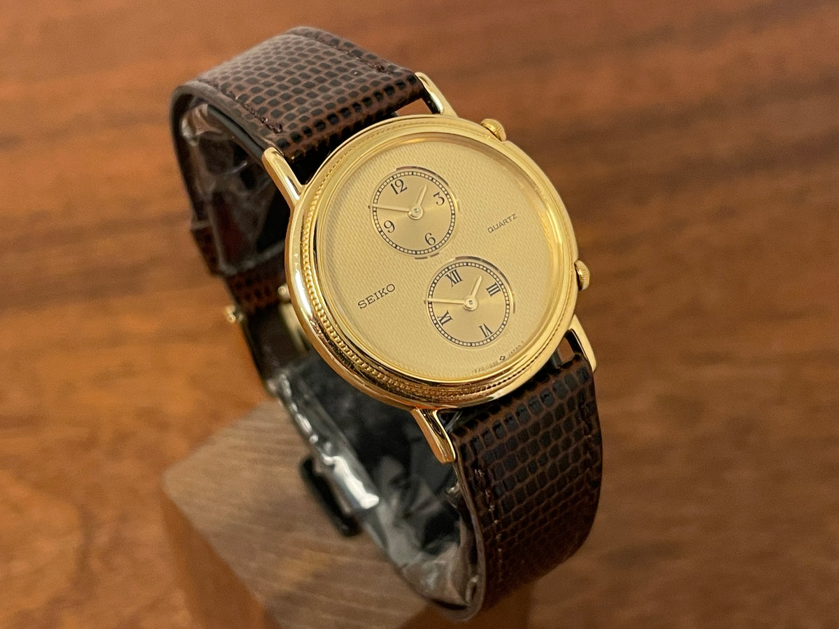 (1985) Seiko 1E20-0160 dual time dress watch - round case - gold textured dial w/ 2 subdials