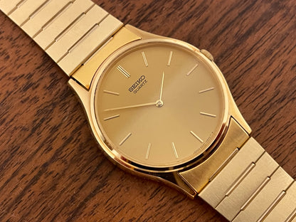 (1983) Seiko 8420-0140 dress watch - gold case - gold sunburst dial w/ gold stick markers (NOS)