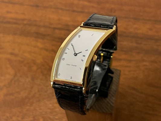 front side (1988) Cleto Munari "Parentesi" by Hans Hollein - asymmetrical 18K gold electroplated case - white dial w/ Roman numerals  (NOS + full set)