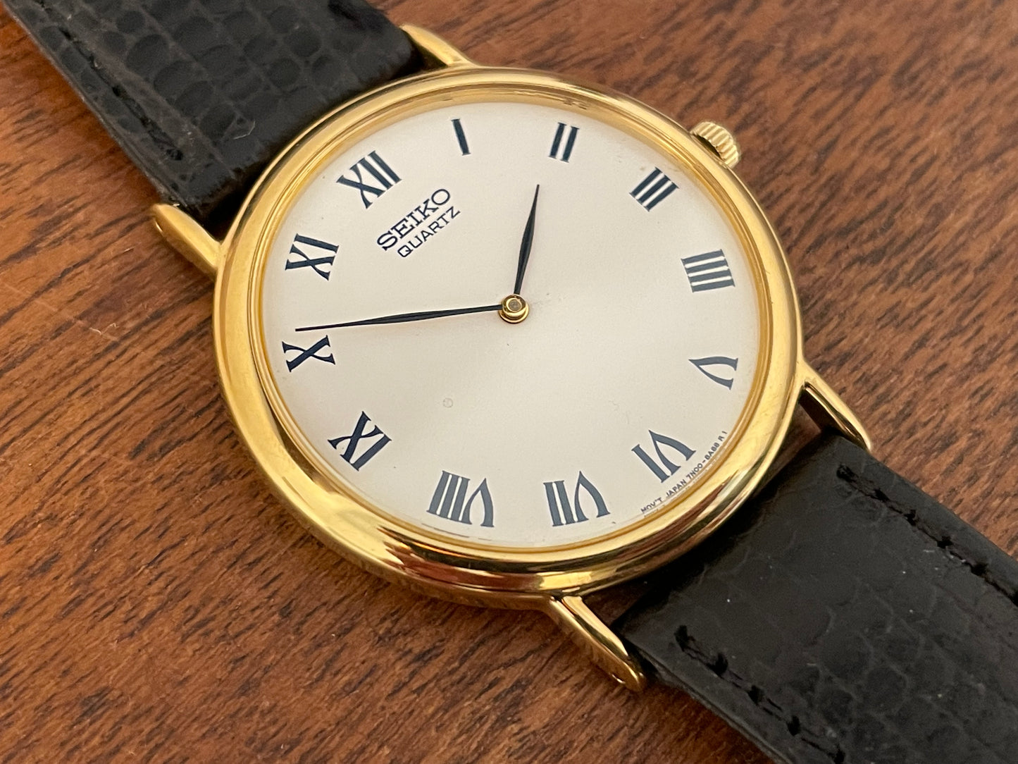 (1991) Seiko 7N00-8A00 dress watch - white dial w/ Roman numerals & Leafe hands (NOS)