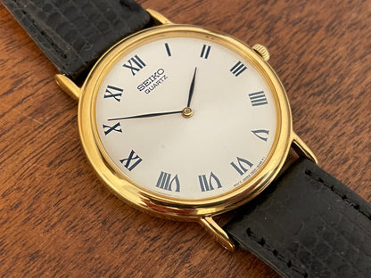 (1991) Seiko 7N00-8A00 dress watch - white dial w/ Roman numerals & Leafe hands (NOS)