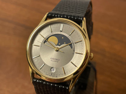 (1986) Seiko 7434-7000 dress watch with moon phase -silver dial w/ gold stick markers (NOS)