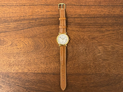 (2000) Pulsar V896-0010 dress watch - white dial w/ black Roman numerals & pointer day (mint)