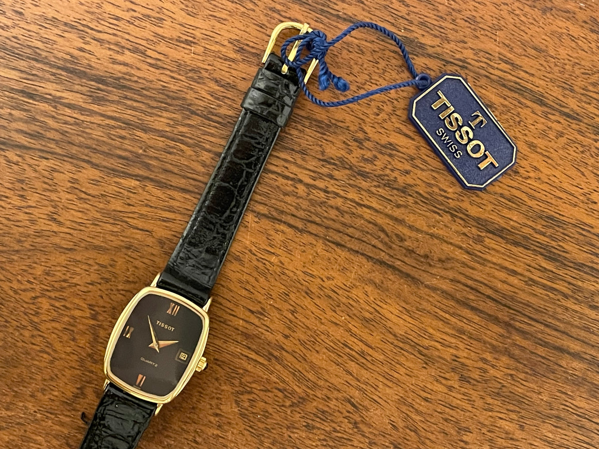 (1980s) Tissot 642.33500/5 Stylist "Ellipse" dress watch - gold case - black dial w/ Roman numerals - small size (NOS)