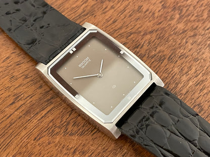 (1970s/1980s) Ricoh 632042 Riquartz "Tank" dress watch - flat taupe dial w/ white markers (NOS)