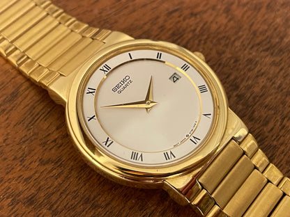 (1992) Seiko 5Y89-7A10 dress watch – white dial w/ Roman numerals & date (NOS)