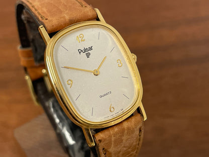 (1985) Pulsar V320-5029 "Ellipse" dress watch - gold case - diamond dust dial (NOS)