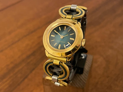 Front side (1970s) Timex 551-211 dress watch - gold case - green dial w/ gold markers - small size (NOS + full set)