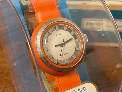 (1970s) Timex 290-181 UFO - orange plastic case - white dial w/ silver markers - small size (NOS + full set)