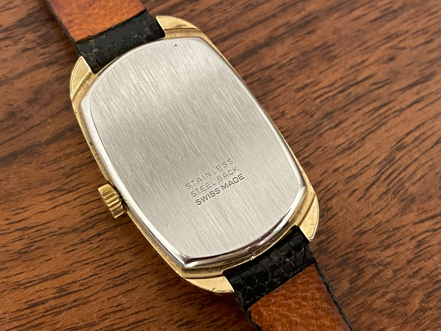 (1979) Timex 100 manual wind dress watch - Swiss made - tonneau case - black dial w/ gold markers