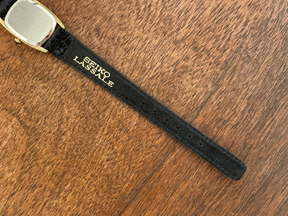 (1980) Seiko 1400-7249 Lassale "Ellipse" dress watch - black dial w/ gold Roman numerals - small size (NOS)