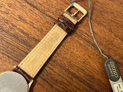 (2003) Seiko 7N01-7041 quartz dress watch - gold case w/ white dial & Arabic numerals (NOS)