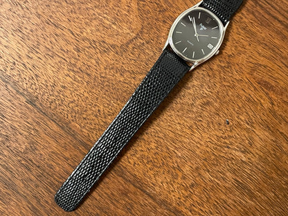 (1982) Pulsar Y112-5099 "Ellipse" dress watch - silver case - black dial w/ silver stick markers (NOS)