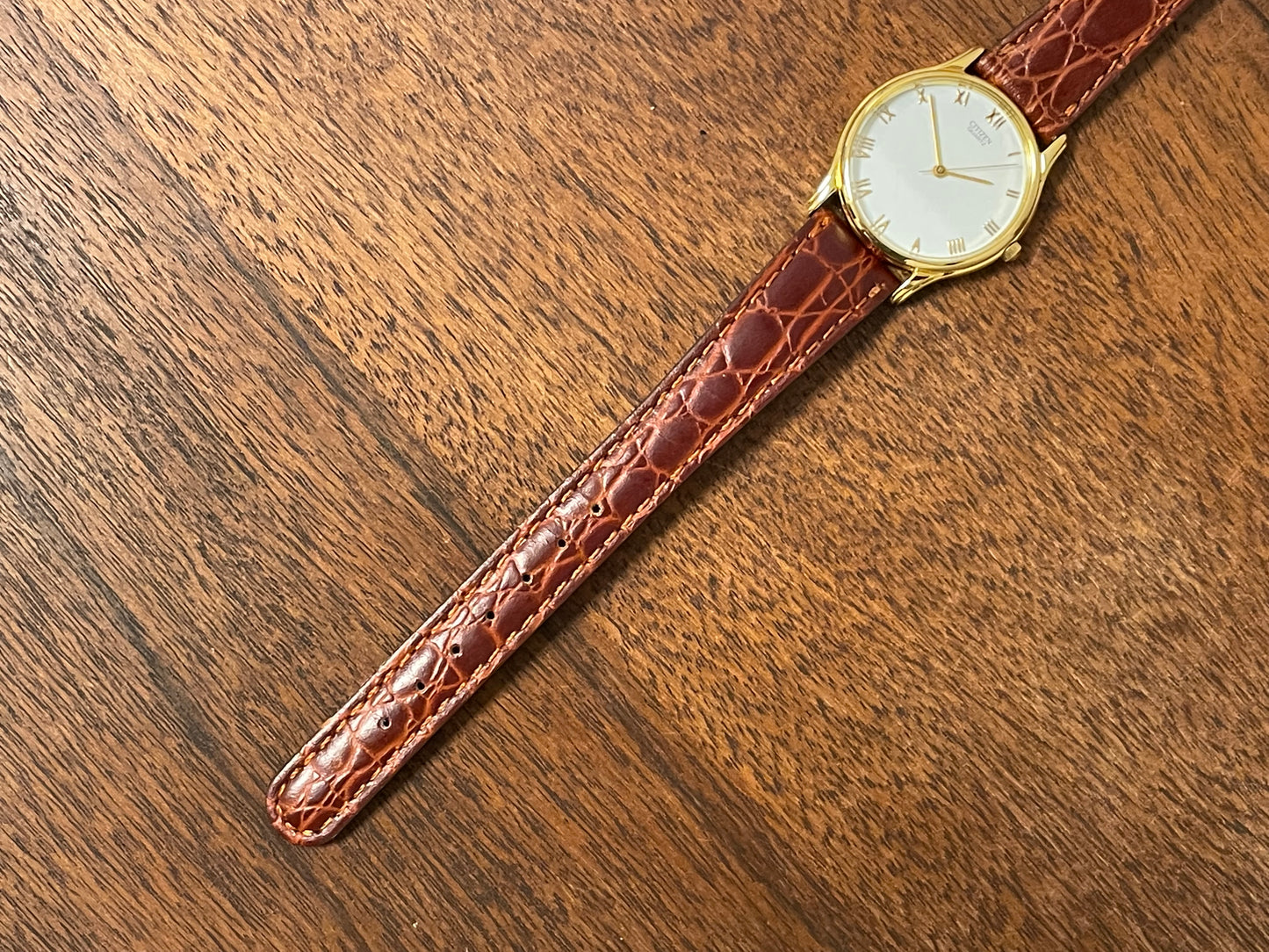 (1981) Citizen 6031-S38419 dress watch - white dial w/ gold Roman numerals - small size (NOS)