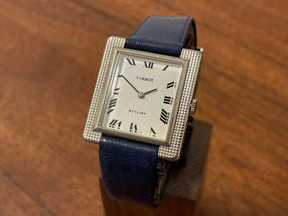 Front side (1970s) Tissot Stylist "Tank" - decorated case - white dial w/ black Roman numerals (NOS)
