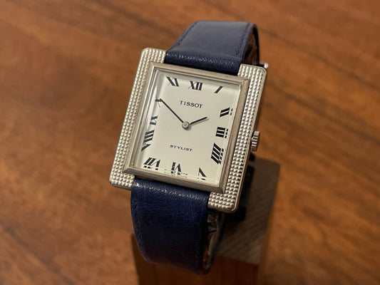 Front side (1970s) Tissot Stylist "Tank" - decorated case - white dial w/ black Roman numerals (NOS)