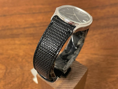 (1982) Pulsar Y112-5099 "Ellipse" dress watch - silver case - black dial w/ silver stick markers (NOS)