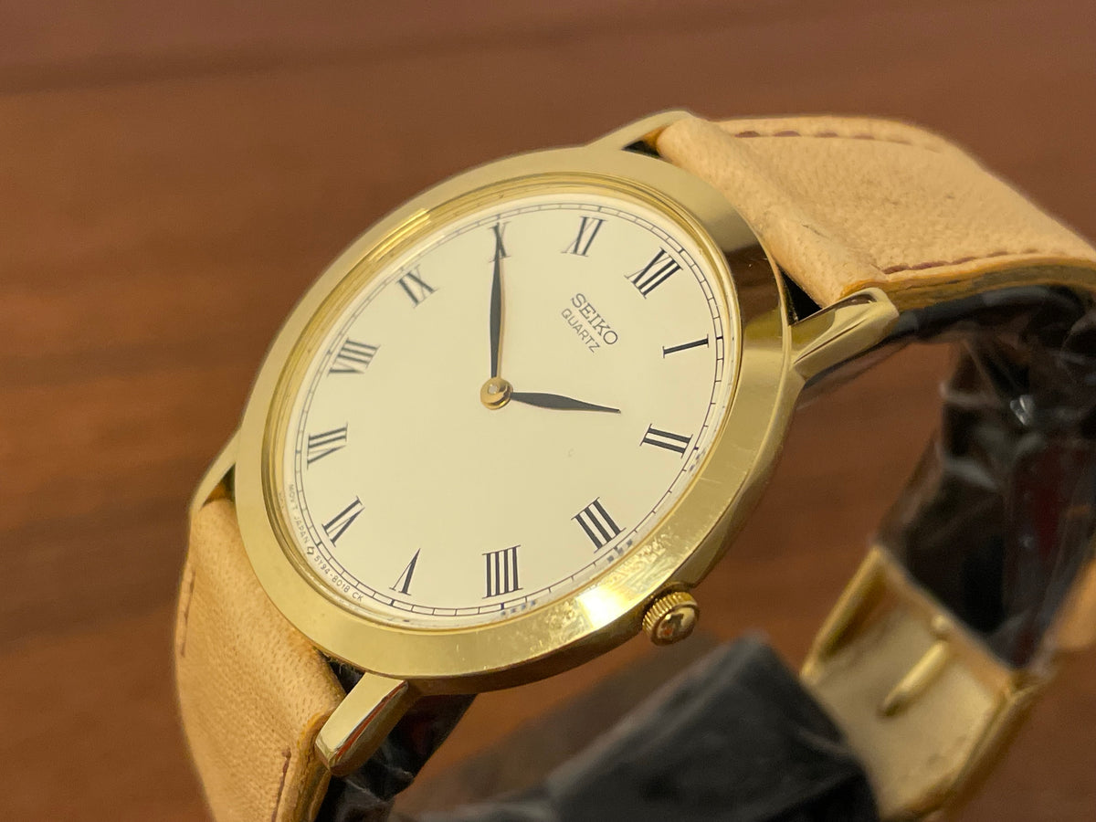 (1989) Seiko 5Y94-8000 dress watch - gold case - cream dial w/ black Roman numerals (NOS)