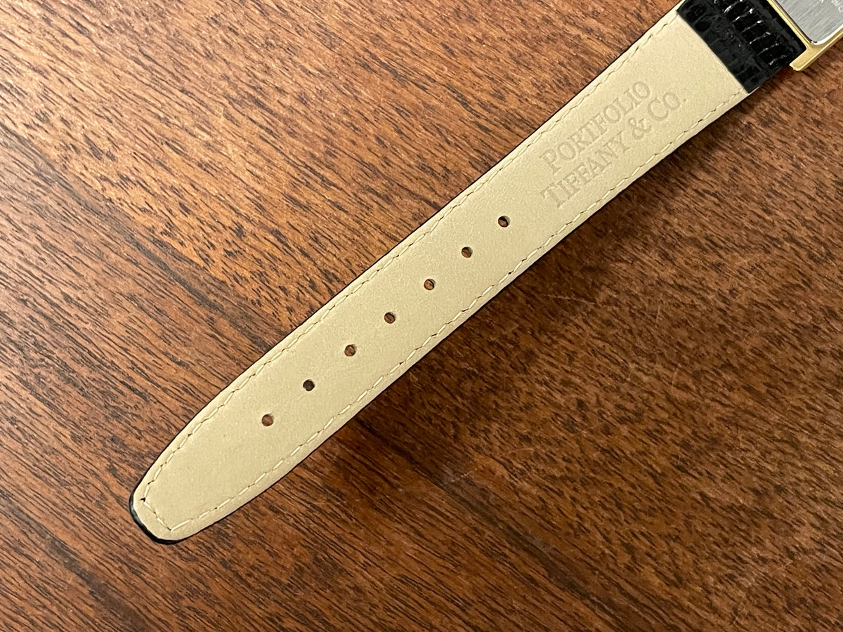 (1998) Tiffany & Co. Portfolio "Tank" dress watch - gold case - white dial w/ black Roman numerals (Mint)