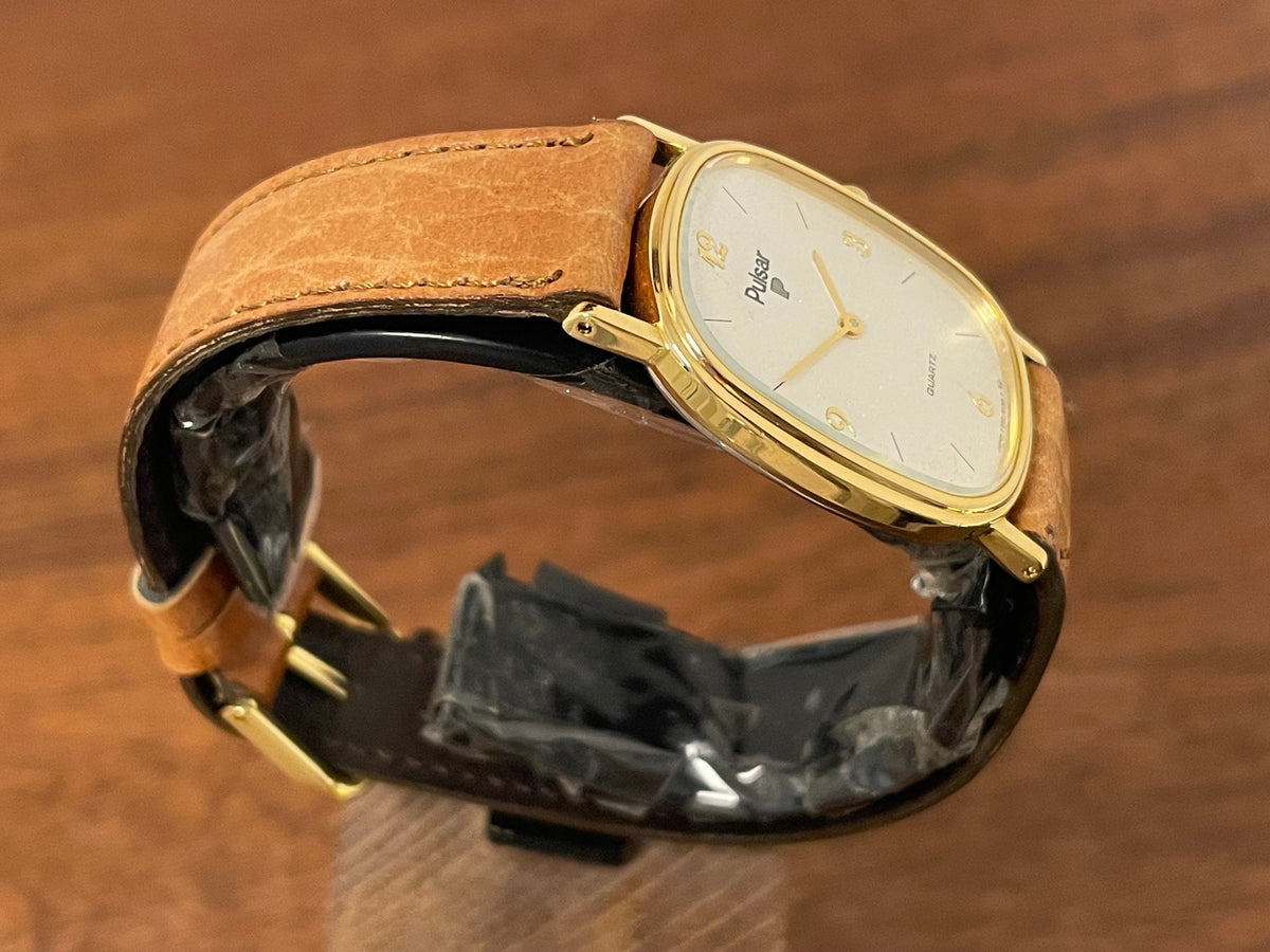 (1985) Pulsar V320-5029 "Ellipse" dress watch - gold case - diamond dust dial (NOS)