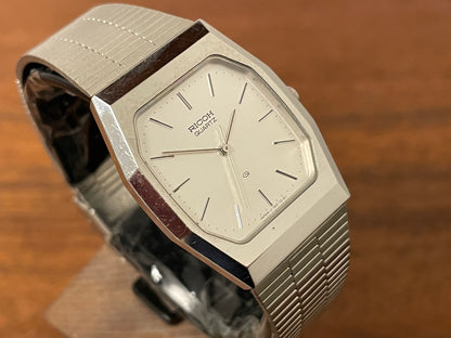 (1977) Ricoh 702008SS dress watch - silver brushed dial w/ silver markers (NOS)