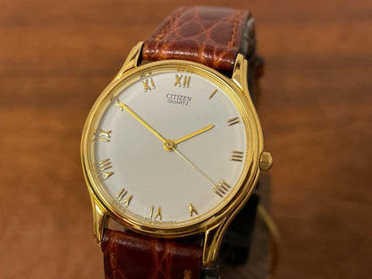 (1981) Citizen 6031-S38419 dress watch - white dial w/ gold Roman numerals - small size (NOS)