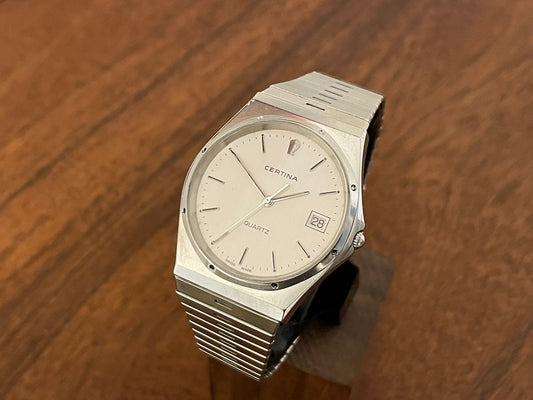 1980s Certina date only with integrated bracelet front view