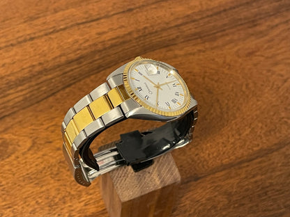 (1980s) Caravelle (manufactured by Bulova) “Datejust” dress watch